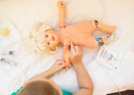 7/29 Doll Port Surgery: Since Natalie was about to have her port surgically removed, I wanted to prep her in a way I knew she’d understand…but doing surgery on her doll’s port of course.