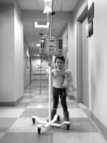 Natalie was pushing her IV pole as she wanted to “take a walk” around the clinic. She looks so big in this photo. It was a “sleepy room” day which meant a spinal of methotrexate and an aspirate to make sure her fluid is still clear of leukemia.
